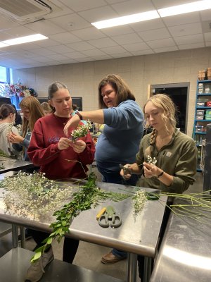 Agricultural educator helps students with floral design
