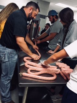 Agricultural educator makes sausage with students